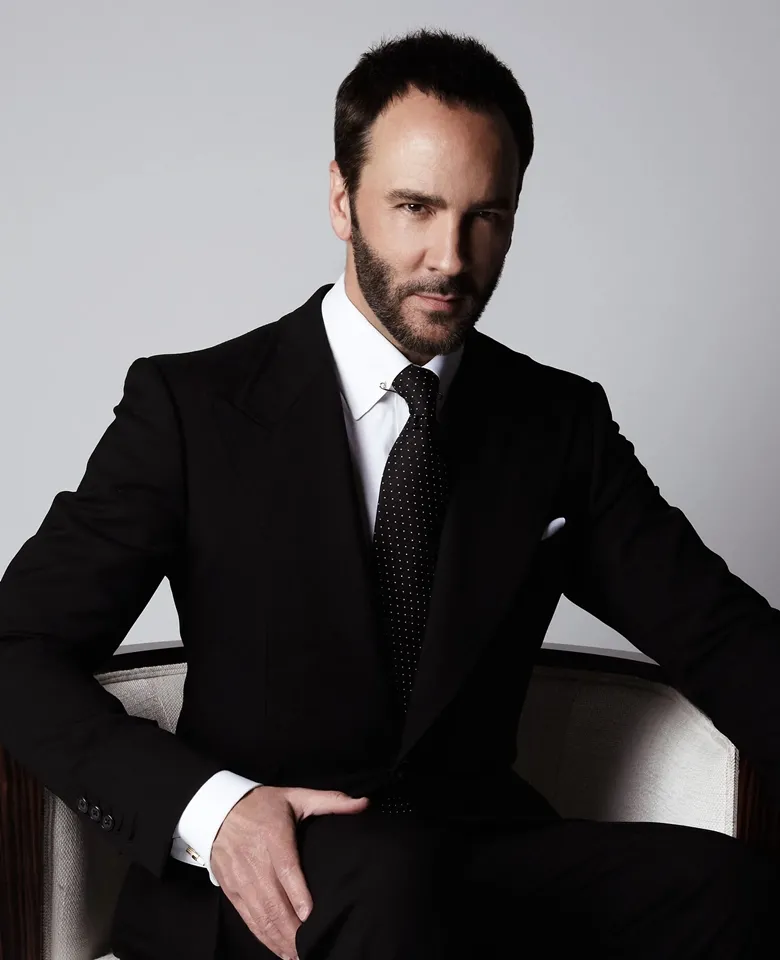 Tom Ford's wearing black suit with necktie